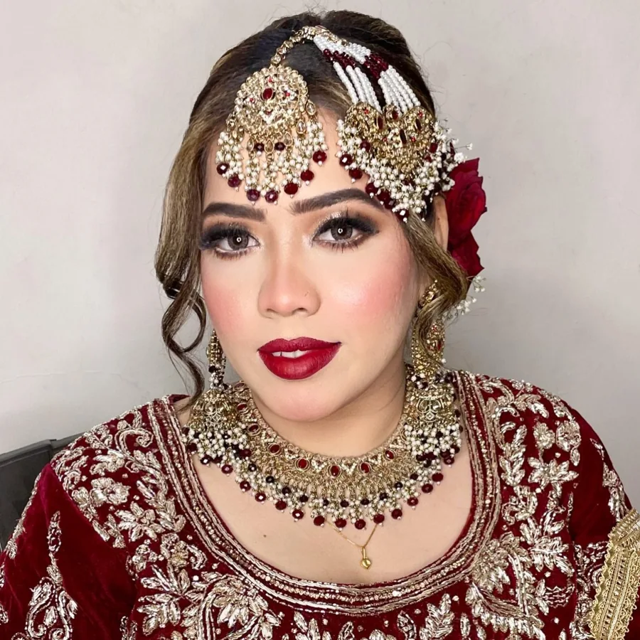 Maroon bridal makeup with detailed jewellery